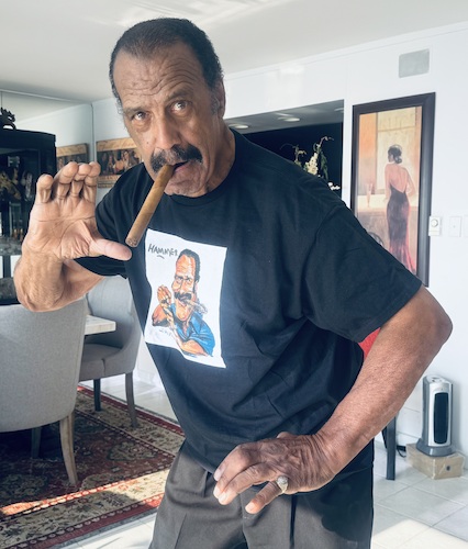 Cartoon: Fred Williamson with my t-shirt! (medium) by Ian Baker tagged fred,williamson,the,hammer,nfl,football,player,actor,writer,director,producer,movies,martial,art,hollywood,arts,fighting,cigar,ian,baker,cartoon,caricature,artwork,illustration,from,dusk,till,dawn,three,hard,way,blaxploitation,moustache,pose,mash,hell,in,harlem,gary,indiana